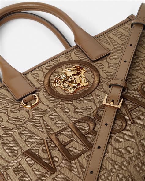 are versace small bags made with different logo|Versace handbags with big zipper.